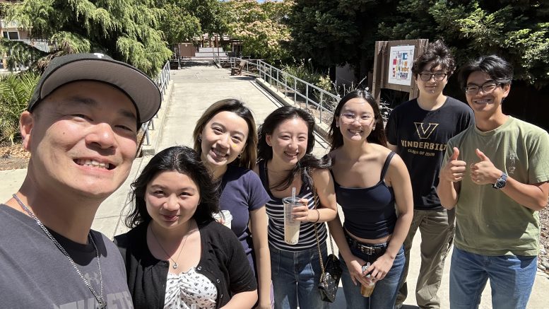 Mr. Jan takes a selfie with some of his past students.